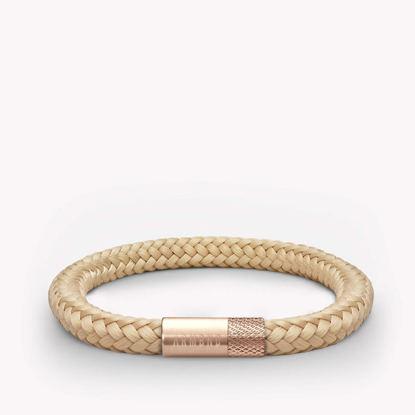 Beige dunne armband met rosé gouden stalen sluiting